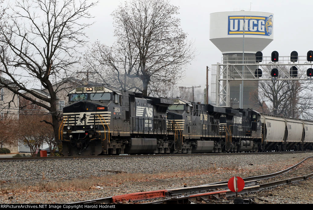 NS 9824 leads train 52E-08 past the signals at Aycock